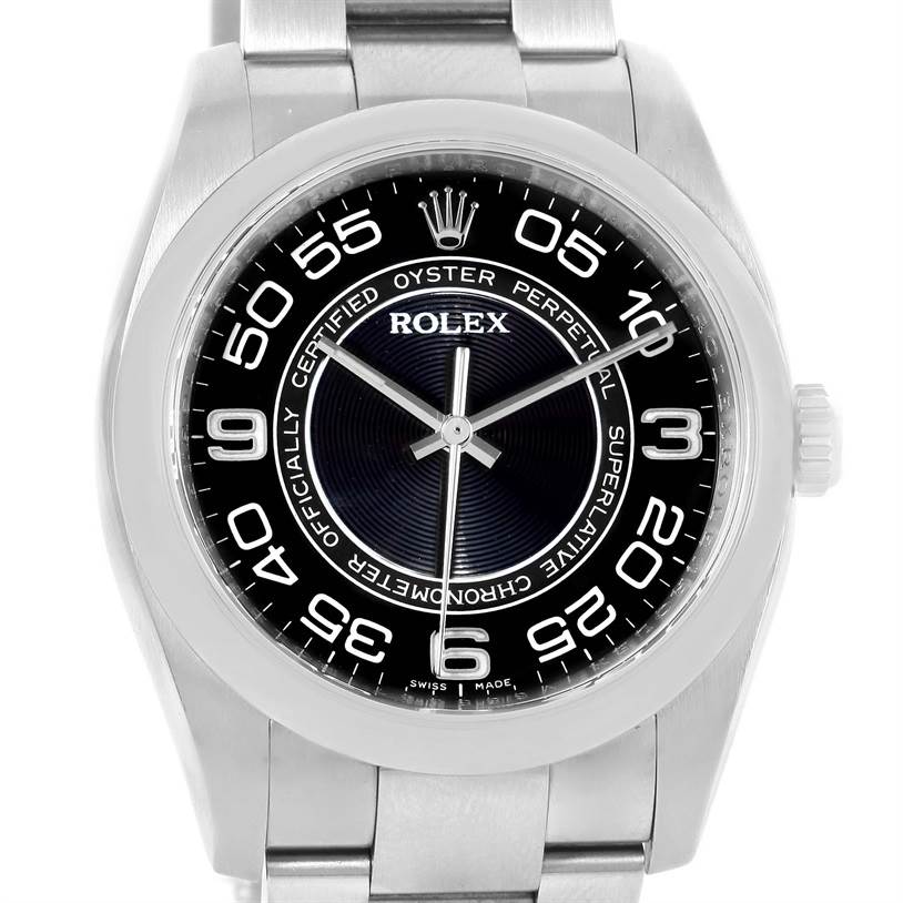The image shows a front view of a Rolex Oyster Perpetual 116000 Men's Stainless Steel Black Dial 116000 Men's Stainless Steel Black Dial watch displaying the face, bezel, and part of the bracelet.