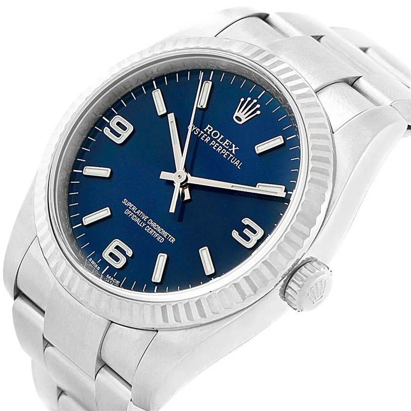 The image shows a Rolex Oyster Perpetual 116034 Men
s Stainless Steel Blue Dial 116034 Men
s Stainless Steel Blue Dial watch at an angled view highlighting the blue dial, bezel, crown, and part of the bracelet.