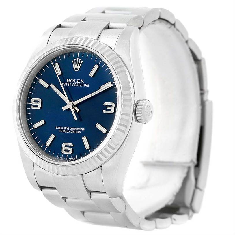 This Rolex Oyster Perpetual 116034 Men
s Stainless Steel Blue Dial 116034 Men
s Stainless Steel Blue Dial watch is shown at a slight angle, displaying its blue dial, bezel, case, crown, and part of the bracelet.