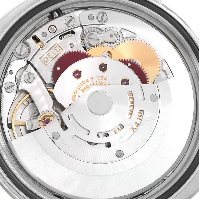 This image shows a close-up view of the inner mechanical movement of a Rolex Oyster Perpetual 116034 Men
s Stainless Steel Blue Dial 116034 Men
s Stainless Steel Blue Dial watch.