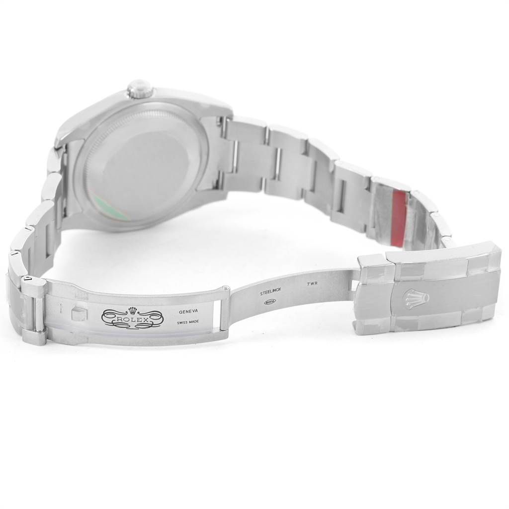 The image shows the backside of a Rolex Oyster Perpetual 116000 Men's Stainless Steel Black Dial 116000 Men's Stainless Steel Black Dial watch, highlighting the open clasp and bracelet links.