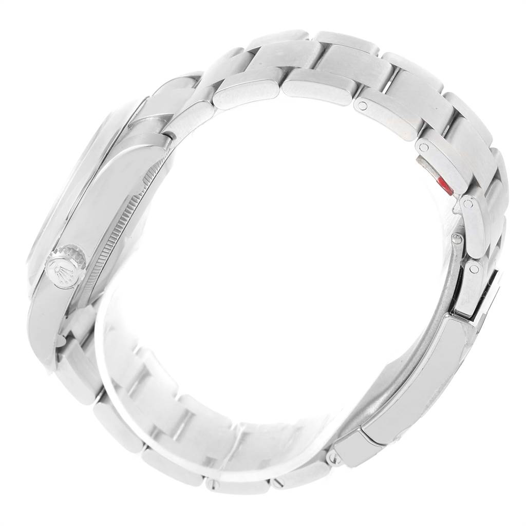 The image shows a side view of the bracelet, crown, and clasp of a Rolex Oyster Perpetual 116000 Men's Stainless Steel Black Dial 116000 Men's Stainless Steel Black Dial watch.