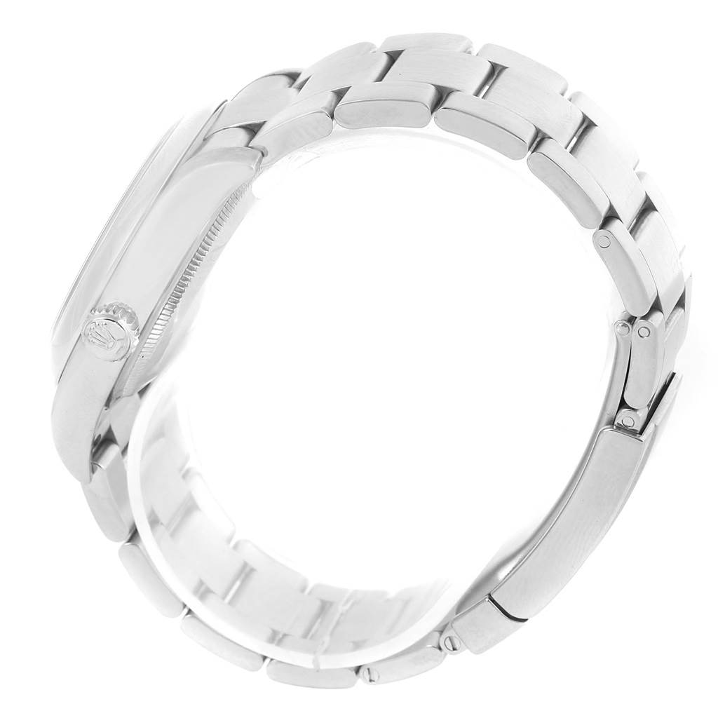 This image shows a side view of the Rolex Oyster Perpetual 116000 Men's Blue Dial 116000 Men's Blue Dial watch focusing on the bracelet and the outer edge of the case.