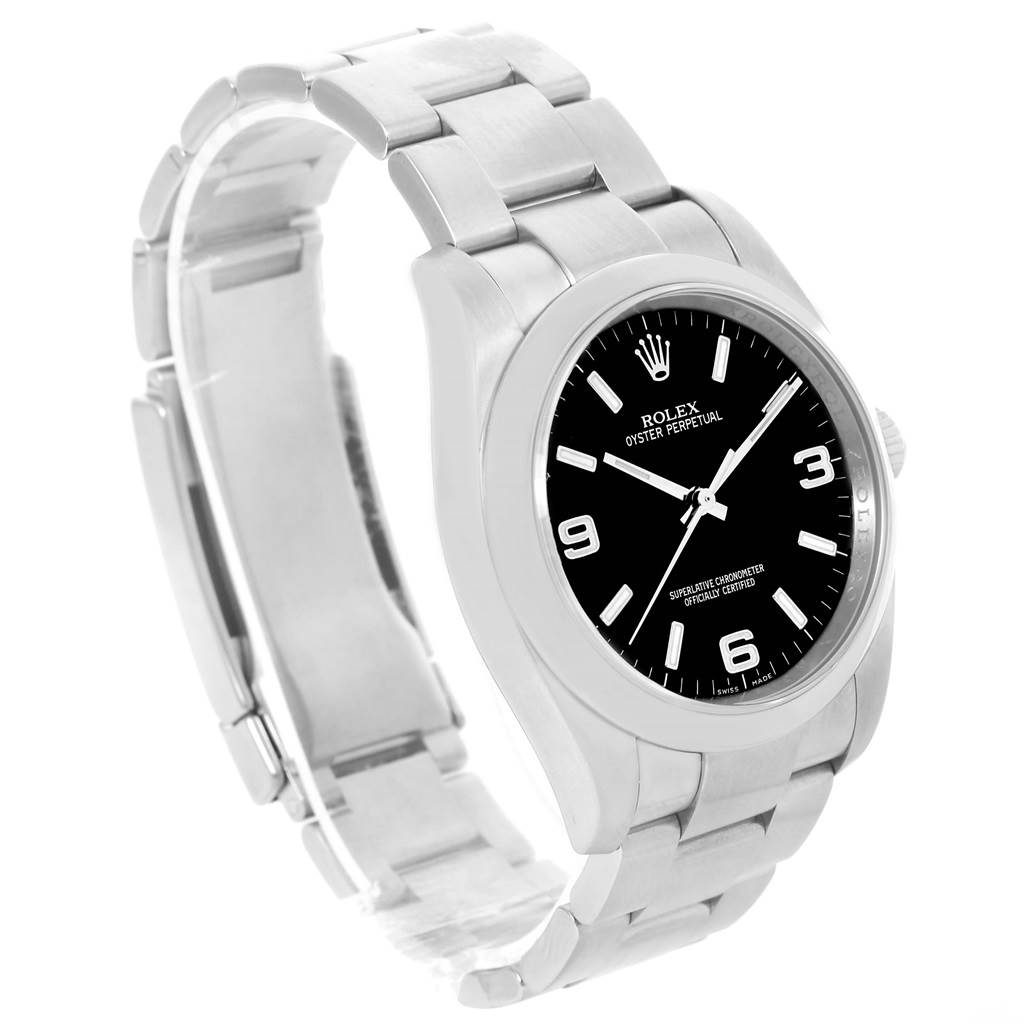 The image shows a Rolex Oyster Perpetual 116000 Men's Stainless Steel Black Dial 116000 Men's Stainless Steel Black Dial watch at a three-quarters angle, highlighting its black dial, stainless steel bracelet, and clasp.