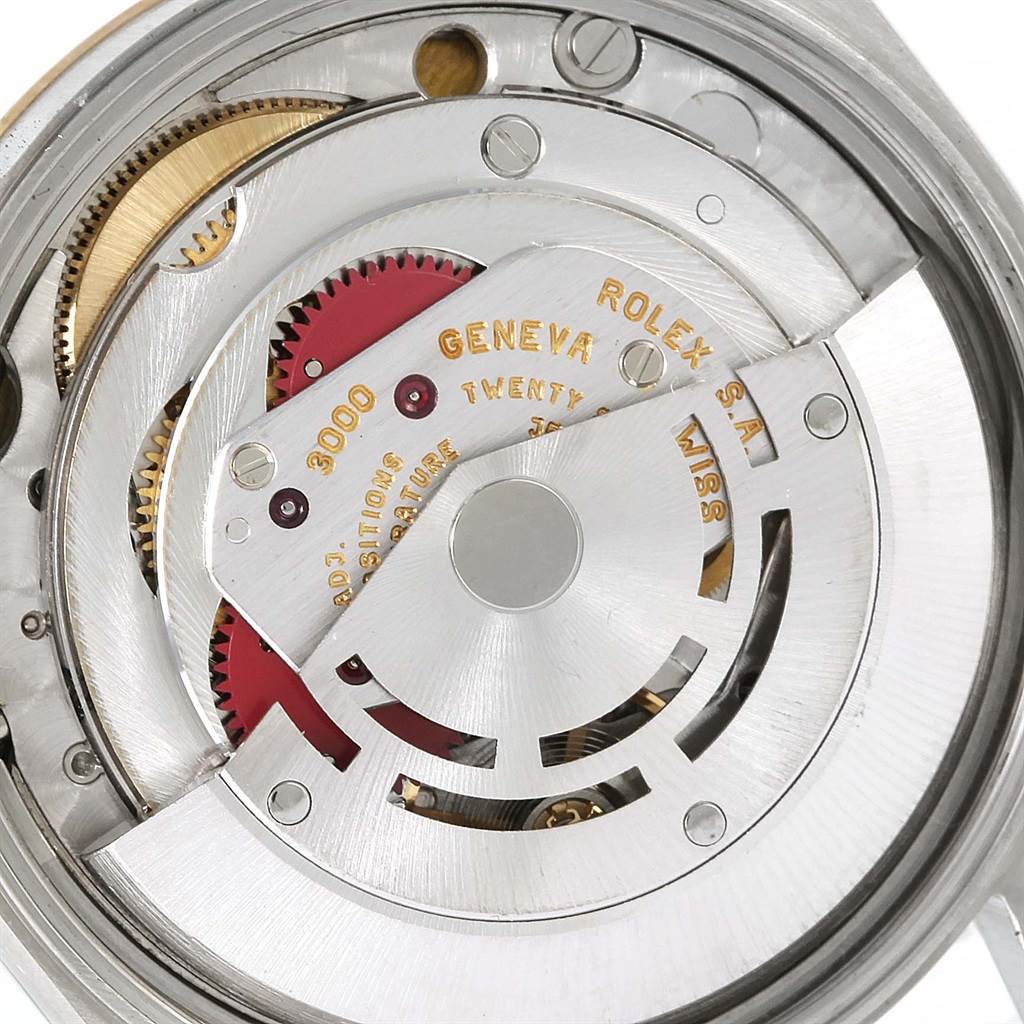 This image shows the movement of a Rolex Oyster Perpetual 14203 Men
s Steel and Gold (two tone) White Dial 14203 Men
s Steel and Gold (two tone) White Dial watch from a top-down angle, highlighting the gears and mechanism components.