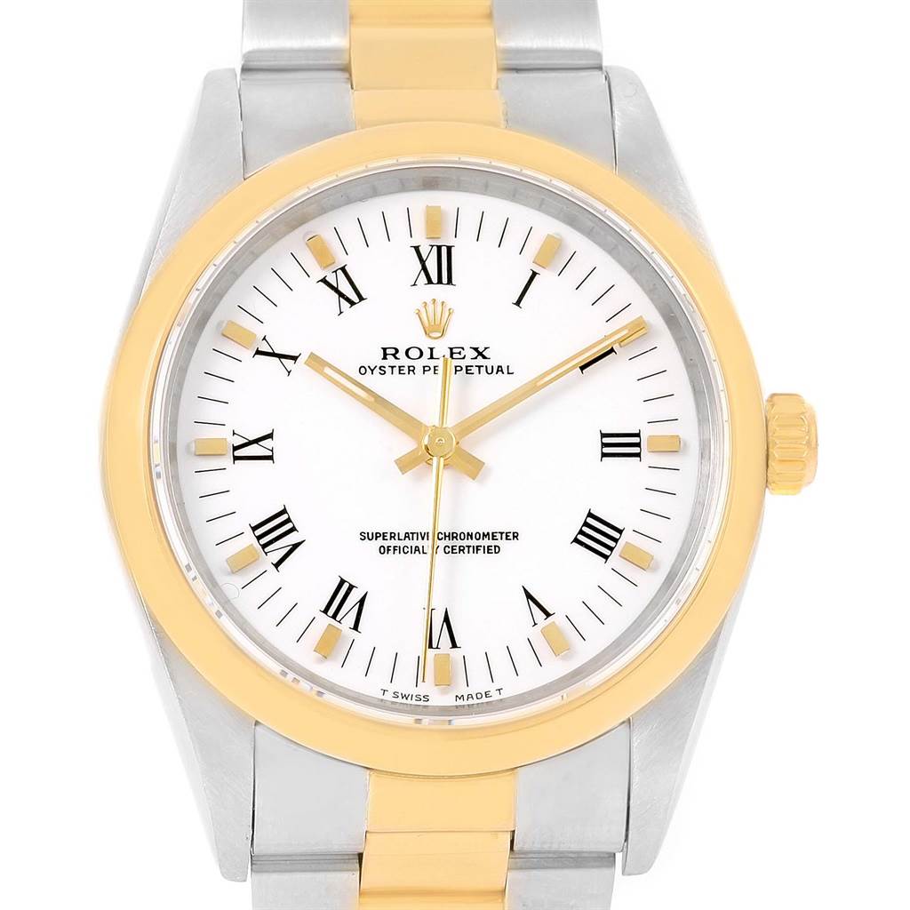 This image shows the front view of a Rolex Oyster Perpetual 14203 Men
s Steel and Gold (two tone) White Dial 14203 Men
s Steel and Gold (two tone) White Dial watch, highlighting the dial, bezel, and part of the bracelet.