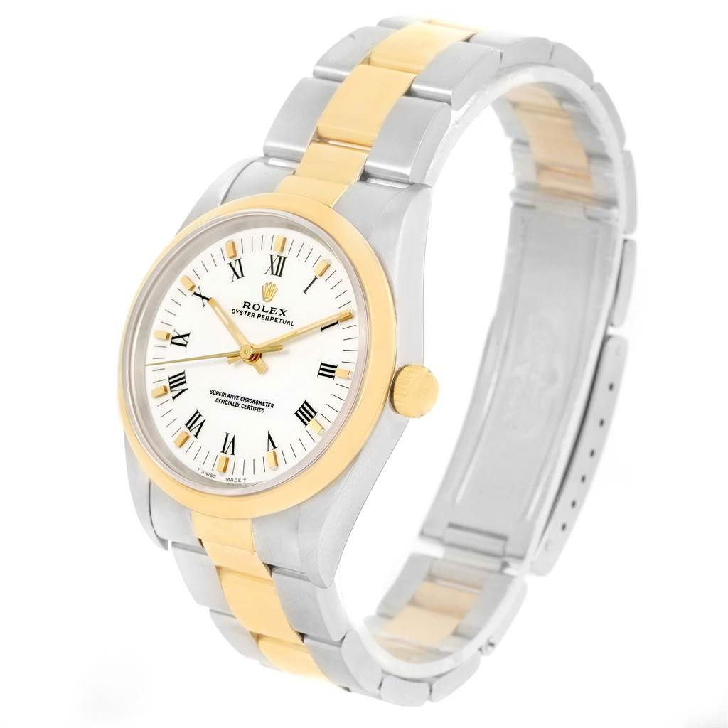The Rolex Oyster Perpetual 14203 Men
s Steel and Gold (two tone) White Dial 14203 Men
s Steel and Gold (two tone) White Dial watch is displayed at a slight angle, showing the face, bezel, and two-tone bracelet.