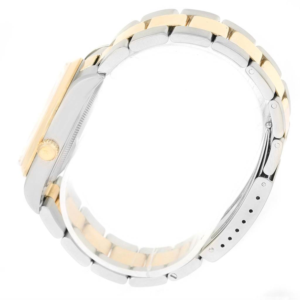 The image shows a side view of the Rolex Oyster Perpetual 14203 Men
s Steel and Gold (two tone) White Dial 14203 Men
s Steel and Gold (two tone) White Dial watch, highlighting its clasp and bracelet.