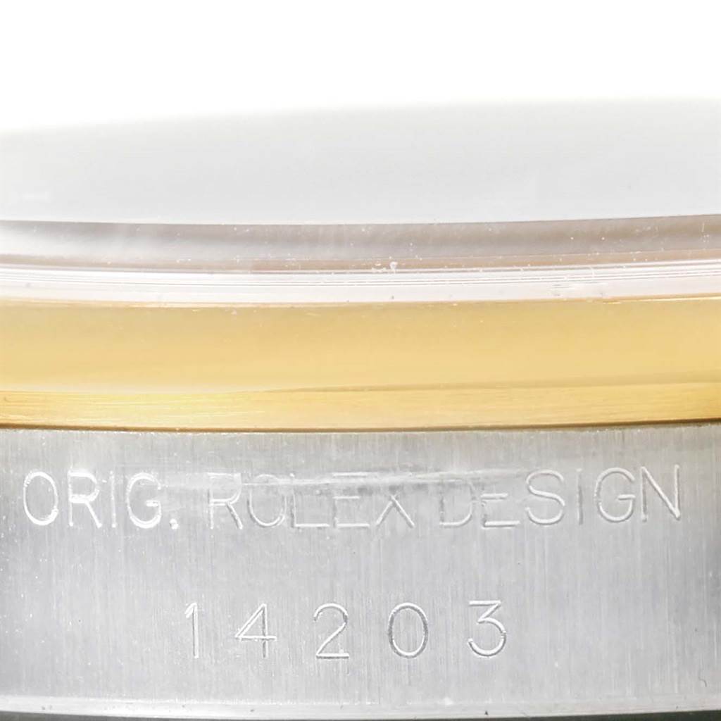 This image shows a close-up view of the case side of the Rolex Oyster Perpetual 14203 Men
s Steel and Gold (two tone) White Dial 14203 Men
s Steel and Gold (two tone) White Dial, highlighting the model number and brand engraving.