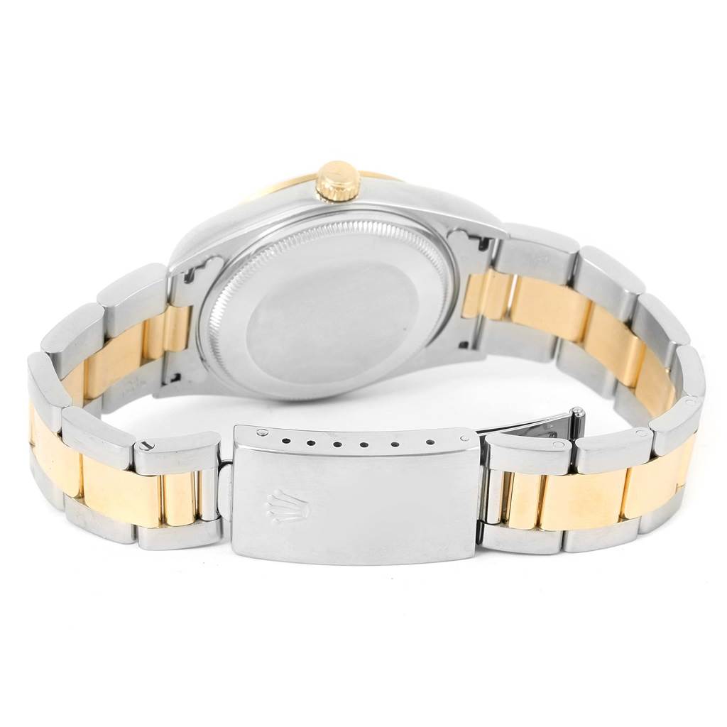 This image shows the back casing and bracelet of the Rolex Oyster Perpetual 14203 Men
s Steel and Gold (two tone) White Dial 14203 Men
s Steel and Gold (two tone) White Dial watch.