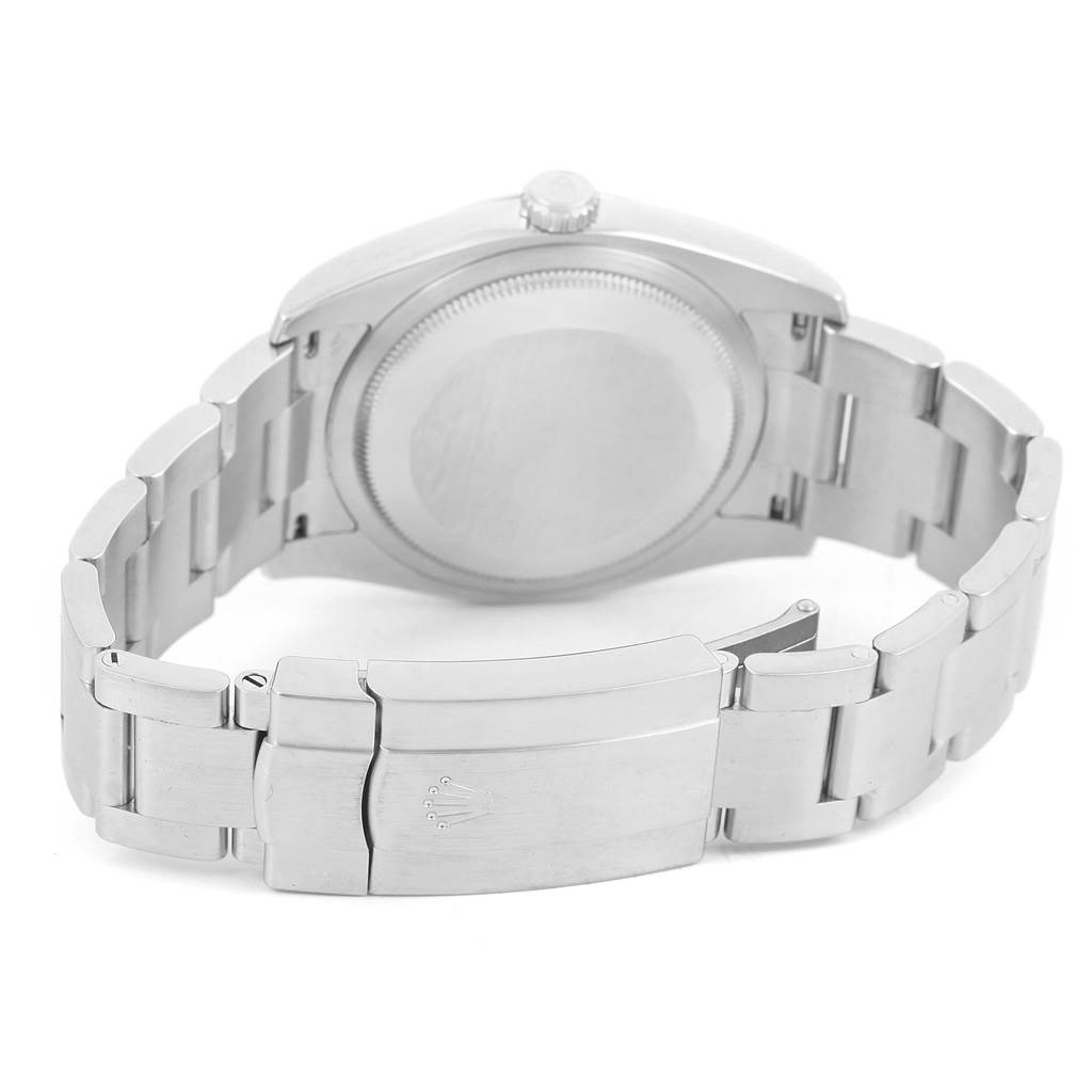 The image shows the back view of a Rolex Oyster Perpetual 116000 Men's Stainless Steel Black Dial 116000 Men's Stainless Steel Black Dial watch, highlighting the case back and clasp.