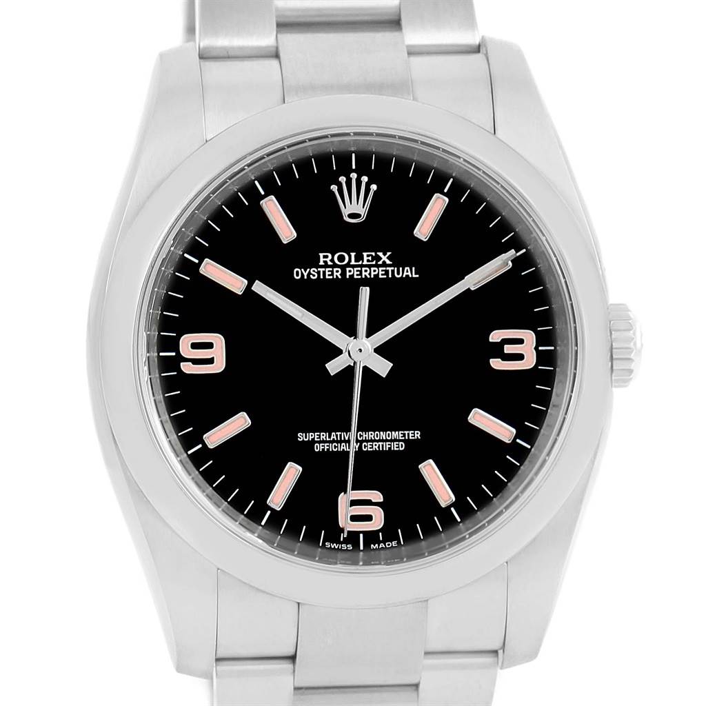 The image shows a front view of a Rolex Oyster Perpetual 116000 Men's Stainless Steel Black Dial 116000 Men's Stainless Steel Black Dial watch, displaying the black dial, indices, hands, and part of the bracelet.