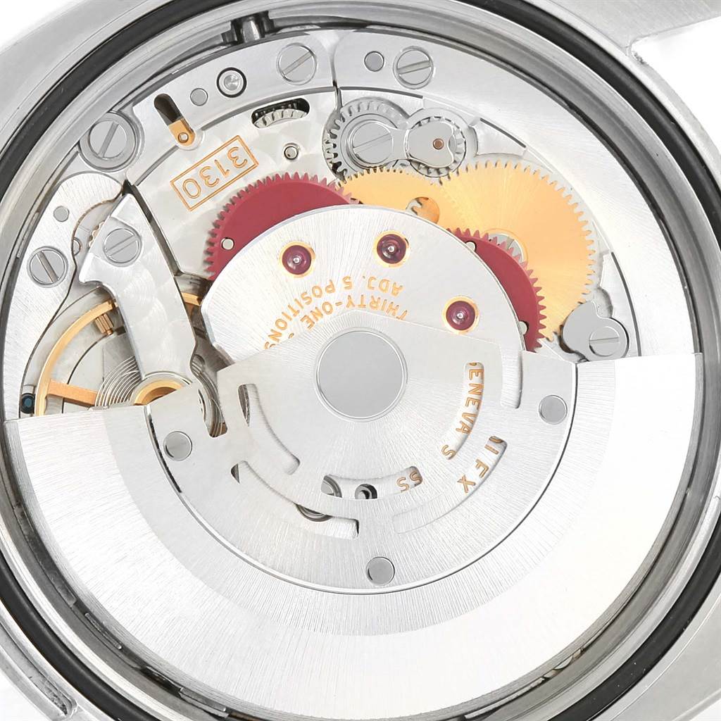 This image shows the intricate internal mechanics and gears of the Rolex Oyster Perpetual 116000 Men's Stainless Steel Black Dial 116000 Men's Stainless Steel Black Dial watch from a close-up angle.