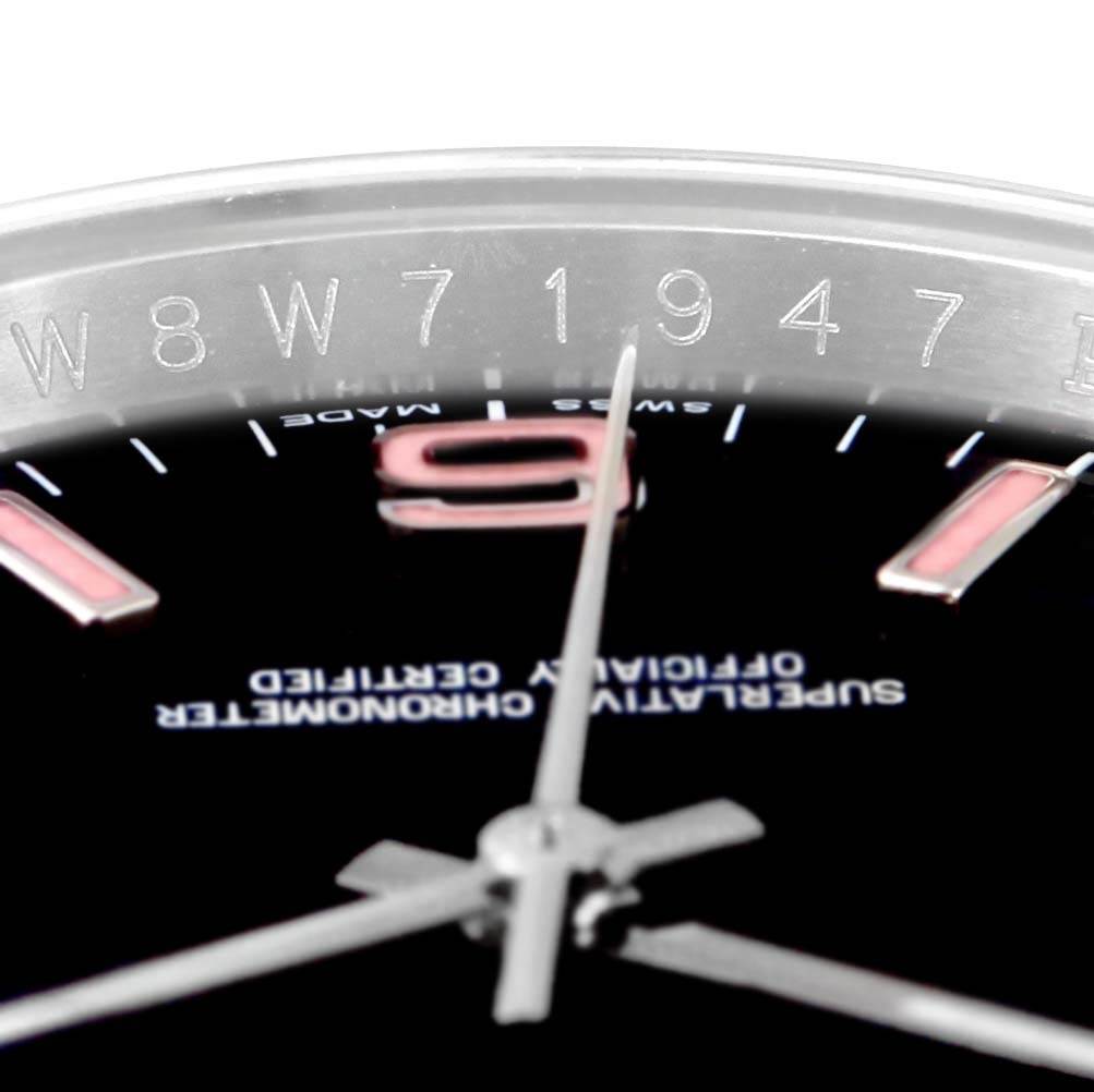 This image shows a close-up of the dial and part of the bezel of a Rolex Oyster Perpetual 116000 Men's Stainless Steel Black Dial 116000 Men's Stainless Steel Black Dial watch.