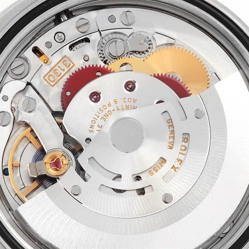 The image shows a close-up view of the movement and inner mechanisms of a Rolex Oyster Perpetual 116000 Men
s Stainless Steel Blue Dial 116000 Men
s Stainless Steel Blue Dial watch.