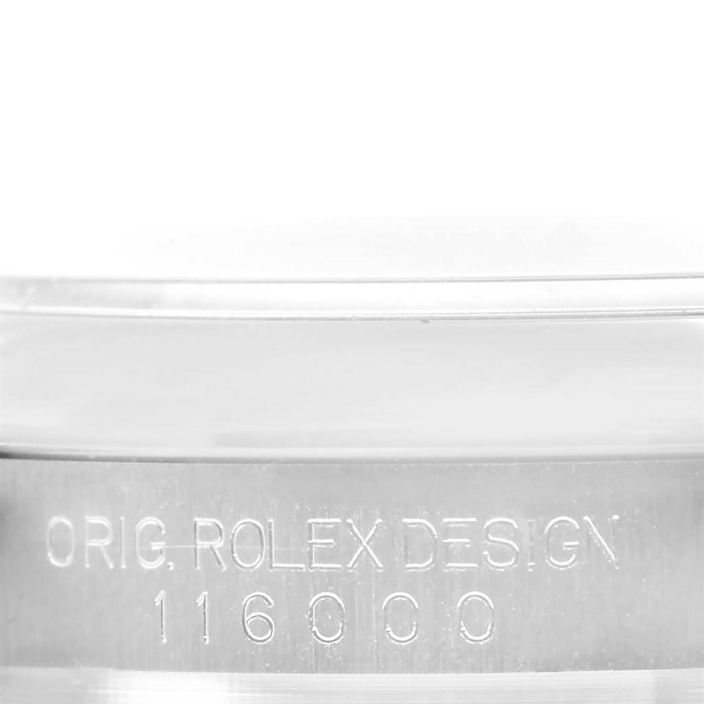 This image shows a close-up of the case side of a Rolex Oyster Perpetual 116000 Men
s Stainless Steel Blue Dial 116000 Men
s Stainless Steel Blue Dial model, displaying its design and model number.