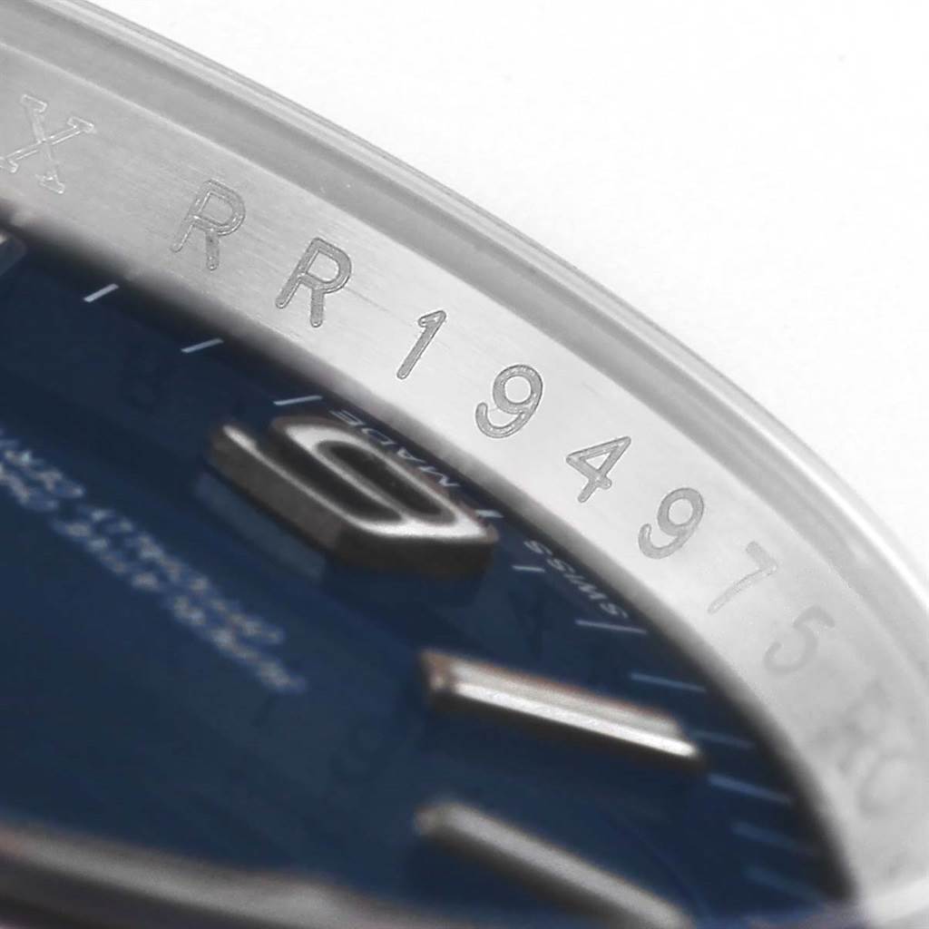 This close-up angle shows the serial number and partial dial of the Rolex Oyster Perpetual 116000 Men
s Stainless Steel Blue Dial 116000 Men
s Stainless Steel Blue Dial watch.