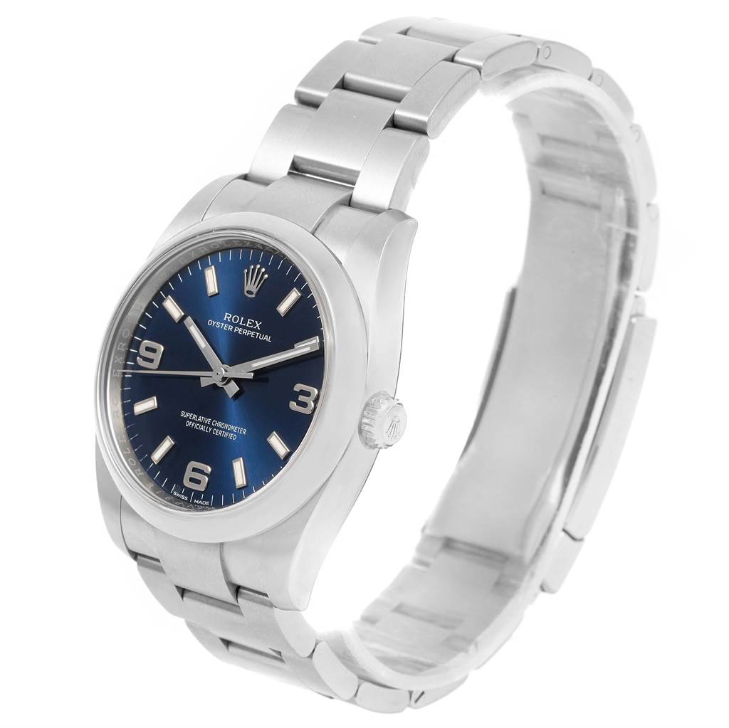 This image shows a Rolex Oyster Perpetual 114200 Men's Stainless Steel Blue Dial 114200 Men's Stainless Steel Blue Dial watch, displaying the watch face, bracelet, and crown, viewed from a three-quarter angle.