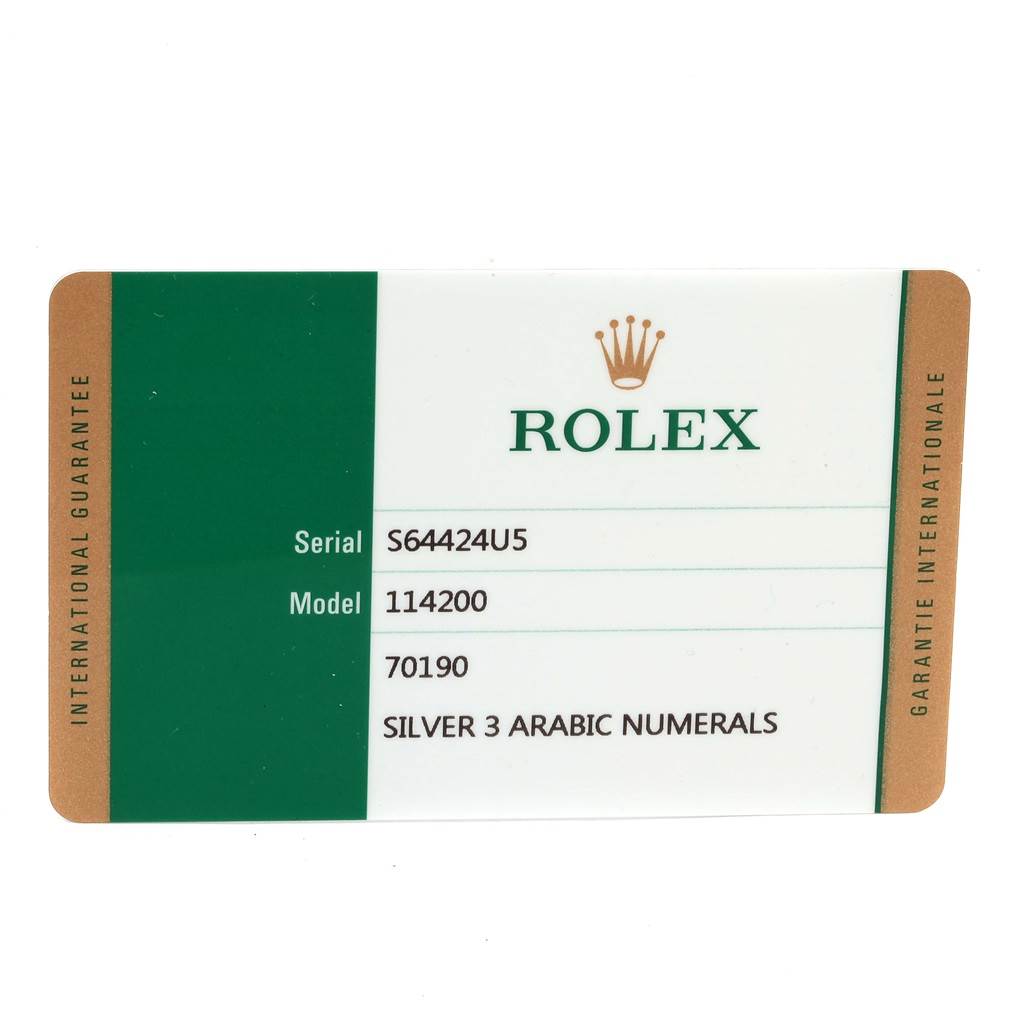 The image shows a warranty card for the Rolex Oyster Perpetual 114200 Men's Stainless Steel Silver Dial 114200 Men's Stainless Steel Silver Dial model, displaying the serial and model numbers.