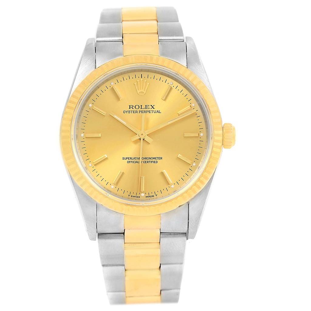 Front view of an Oyster Perpetual Rolex watch showing the dial, bezel, crown, and part of the two-tone bracelet.