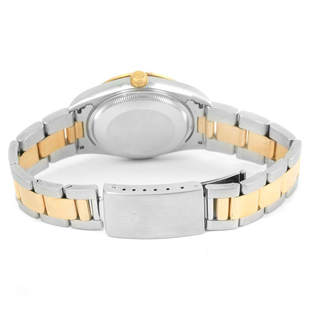 This image shows the back case and bracelet of the Rolex Oyster Perpetual 14233 Men's Steel and Gold (two tone) Champagne Dial 14233 Men's Steel and Gold (two tone) Champagne Dial watch, highlighting its clasp, links, and crown.