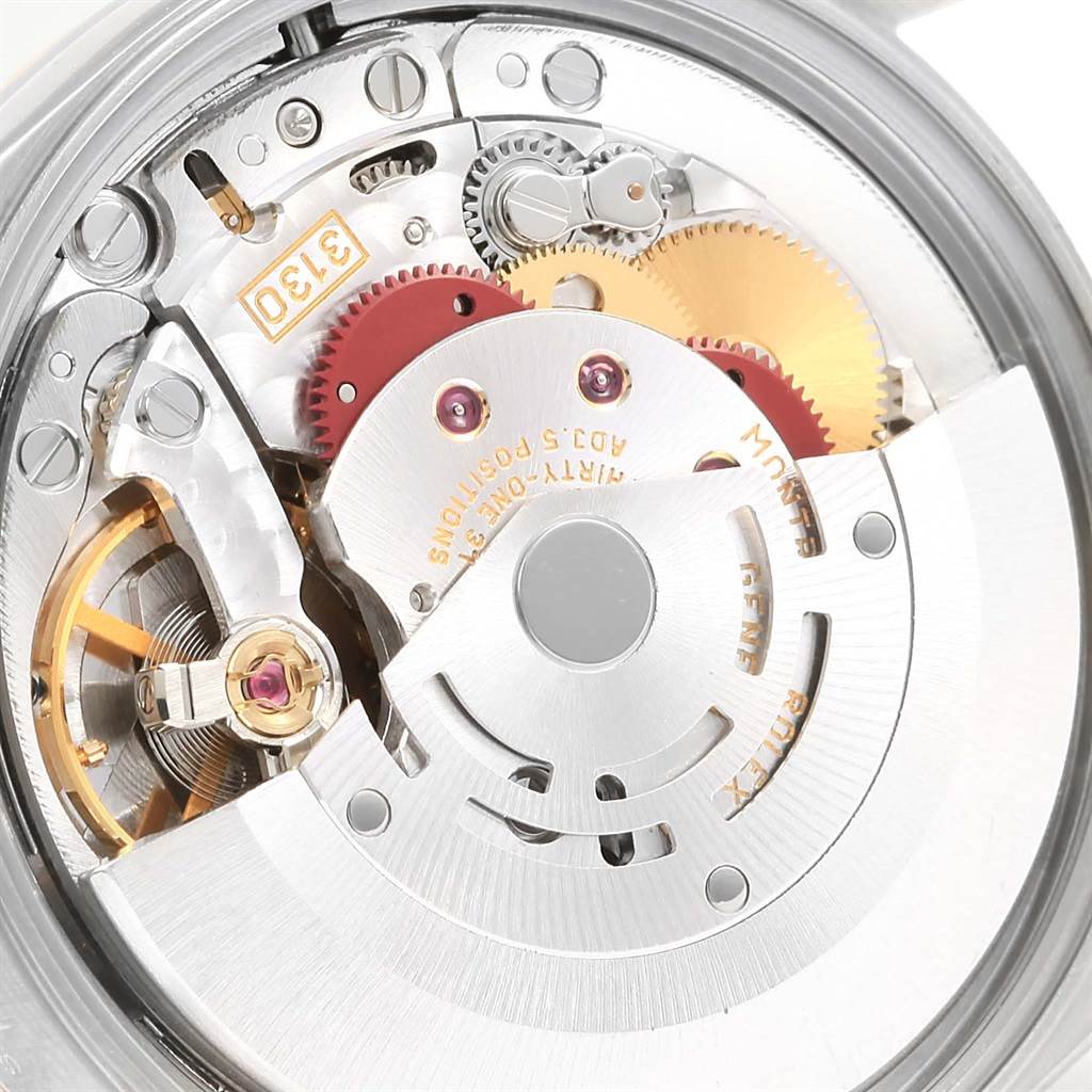 This image shows a close-up of the inner movement and mechanism of the Rolex Oyster Perpetual 14203 Men's Steel and Gold (two tone) Silver Dial 14203 Men's Steel and Gold (two tone) Silver Dial watch model.