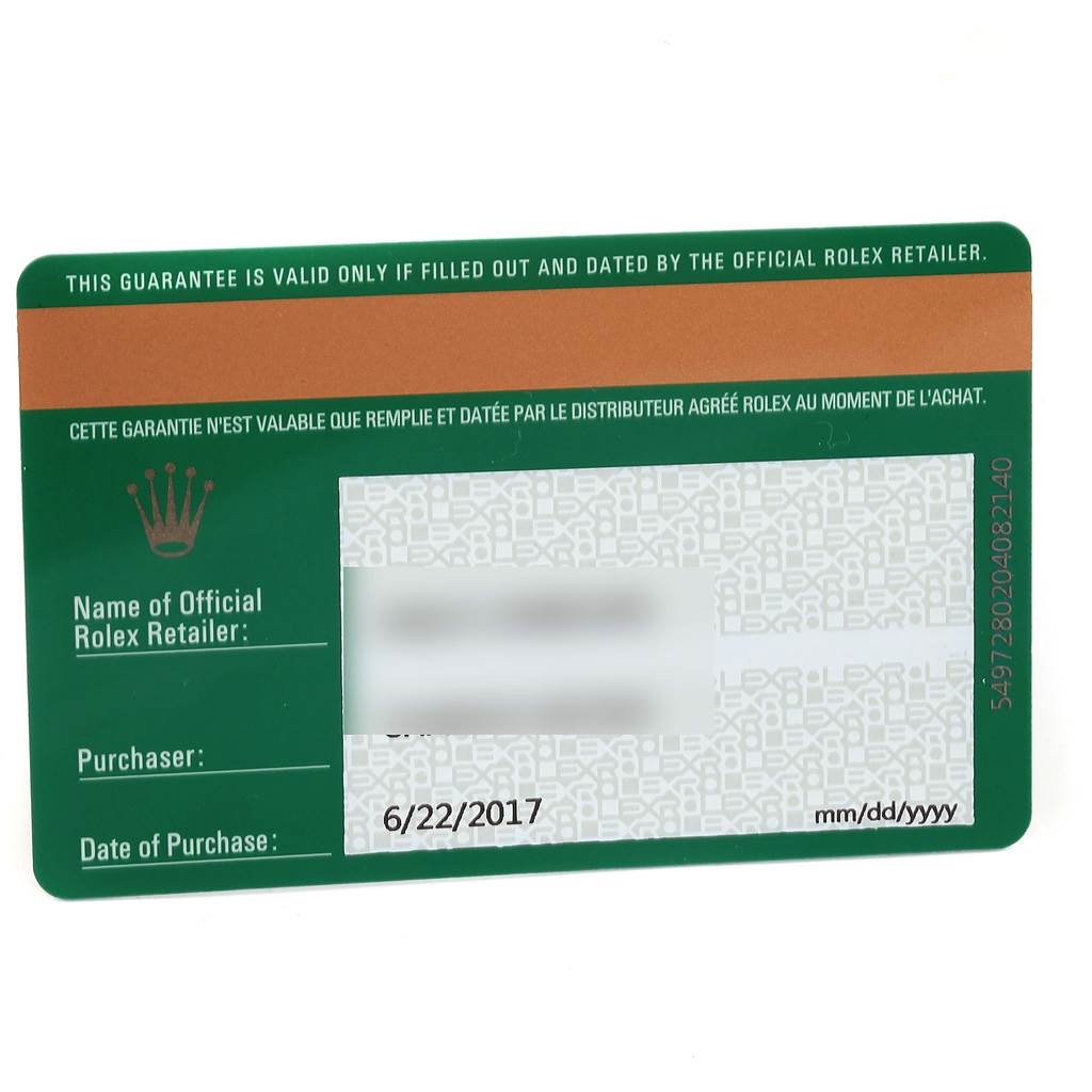 This image shows a guarantee card for a Rolex Oyster Perpetual 114200 Men's Stainless Steel Blue Dial 114200 Men's Stainless Steel Blue Dial watch.