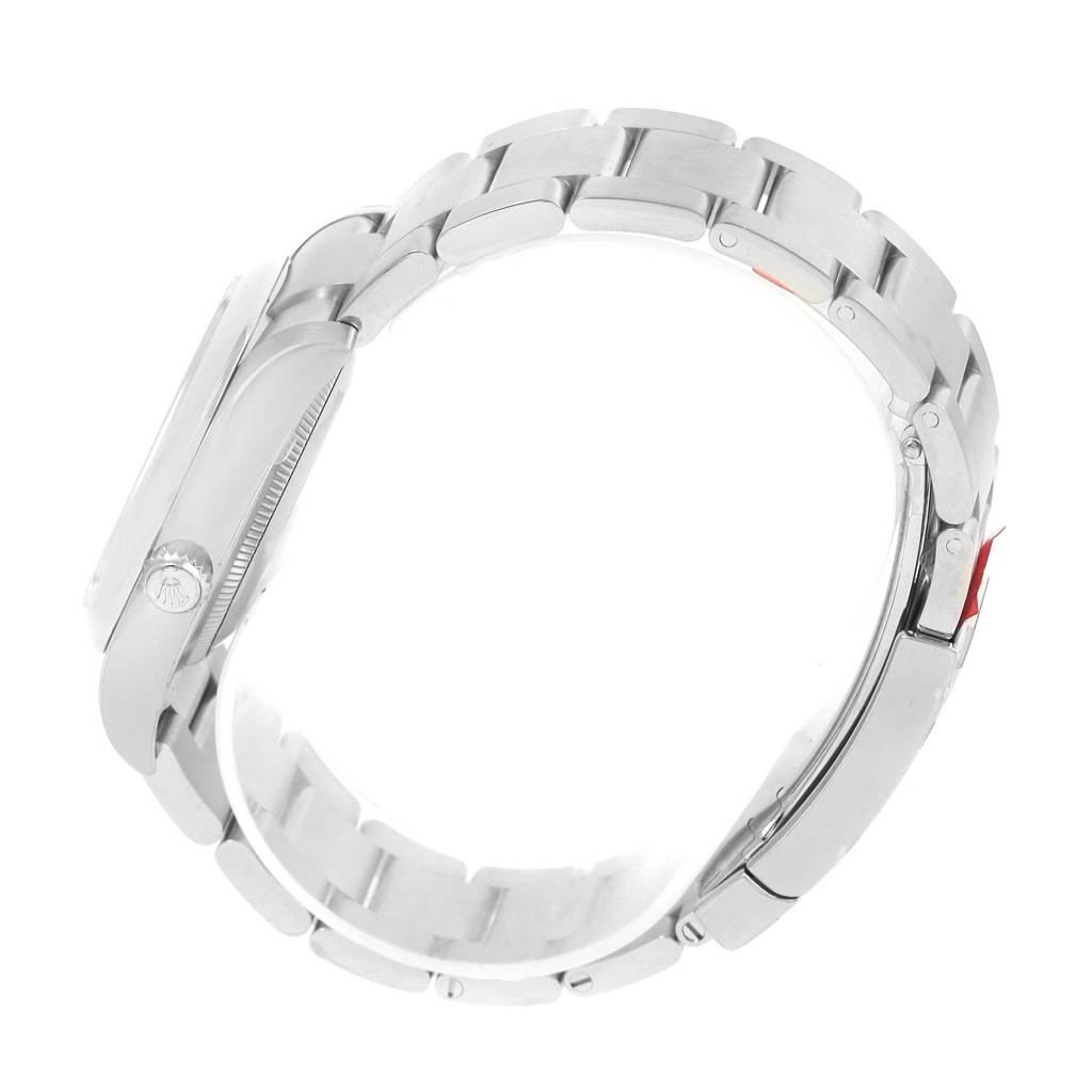 The image shows a side view of a Rolex Oyster Perpetual 114200 Men's Stainless Steel Blue Dial 114200 Men's Stainless Steel Blue Dial watch, particularly highlighting its bracelet and clasp.