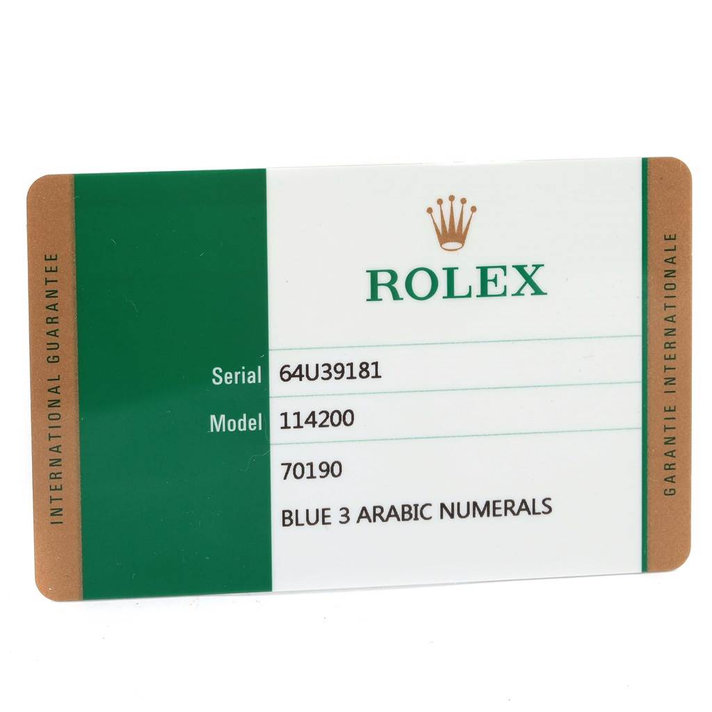 This image shows an international guarantee card for the Rolex Oyster Perpetual 114200 Men's Stainless Steel Blue Dial 114200 Men's Stainless Steel Blue Dial model 114200.
