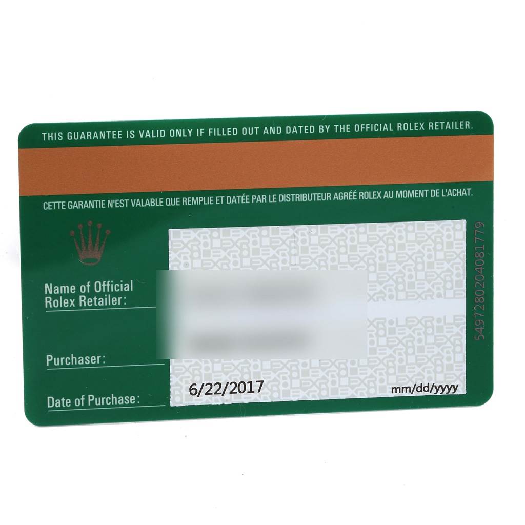 This image shows a guarantee card for the Rolex Oyster Perpetual 114200 Stainless Steel Blue Dial 114200 Stainless Steel Blue Dial model, including retailer name and purchase date.