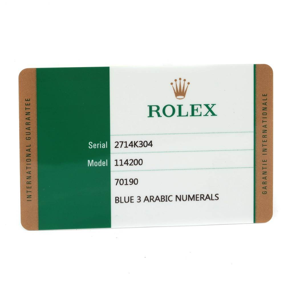 The image shows a guarantee card for a Rolex Oyster Perpetual 114200 Stainless Steel Blue Dial 114200 Stainless Steel Blue Dial model 114200.