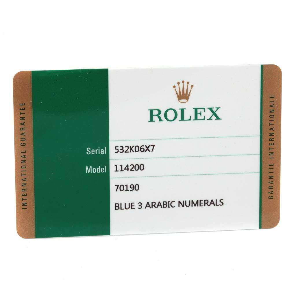 This image shows an international guarantee card for a Rolex Oyster Perpetual 114200 Stainless Steel Blue Dial 114200 Stainless Steel Blue Dial model 114200 watch.