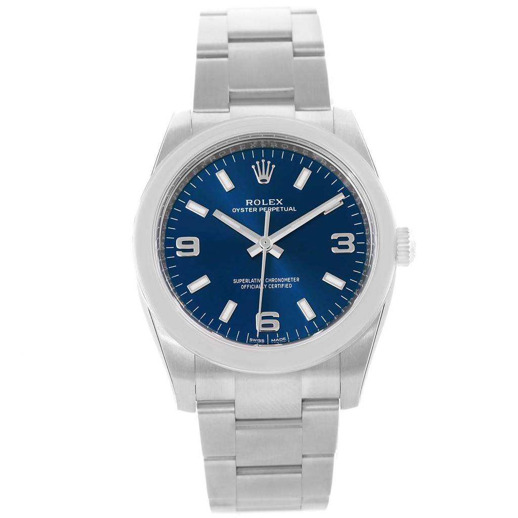 The image shows a frontal view of a Rolex Oyster Perpetual 114200 Stainless Steel Blue Dial 114200 Stainless Steel Blue Dial watch, highlighting its blue dial, stainless steel case, and bracelet.