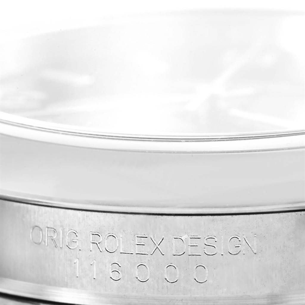 This close-up image shows the side view of a Rolex Oyster Perpetual 116000 Men's Stainless Steel Black Dial 116000 Men's Stainless Steel Black Dial watch case, featuring the engraved model number 116000.