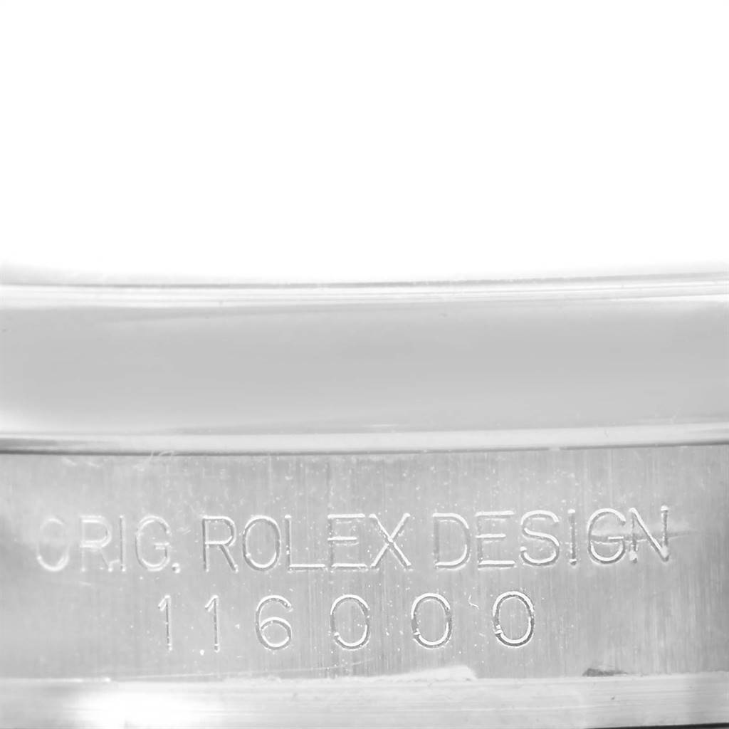 This image shows the case side with etched text "ORIG. ROLEX DESIGN 116000" of the Rolex Oyster Perpetual 116000 Men
s Stainless Steel Black Dial 116000 Men
s Stainless Steel Black Dial watch.
