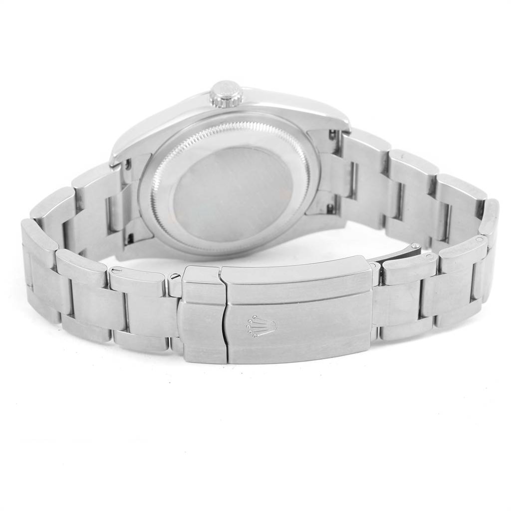 This image shows the Rolex Oyster Perpetual 116000 Men
s Stainless Steel Black Dial 116000 Men
s Stainless Steel Black Dial watch from the rear angle, highlighting its clasp, bracelet, and case back.