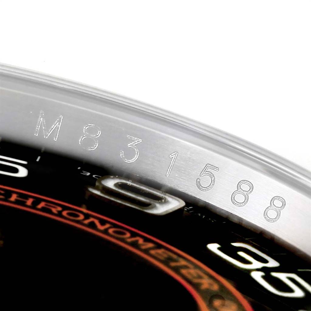 This image shows a close-up angle of the bezel and dial of a Rolex Oyster Perpetual 116000 Men
s Stainless Steel Black Dial 116000 Men
s Stainless Steel Black Dial watch, highlighting the serial number.