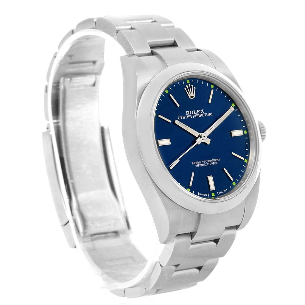 The Rolex Oyster Perpetual 114300 Men's Stainless Steel Blue Dial 114300 Men's Stainless Steel Blue Dial watch is shown at a three-quarter angle, showcasing its blue dial, metal bracelet, and crown.