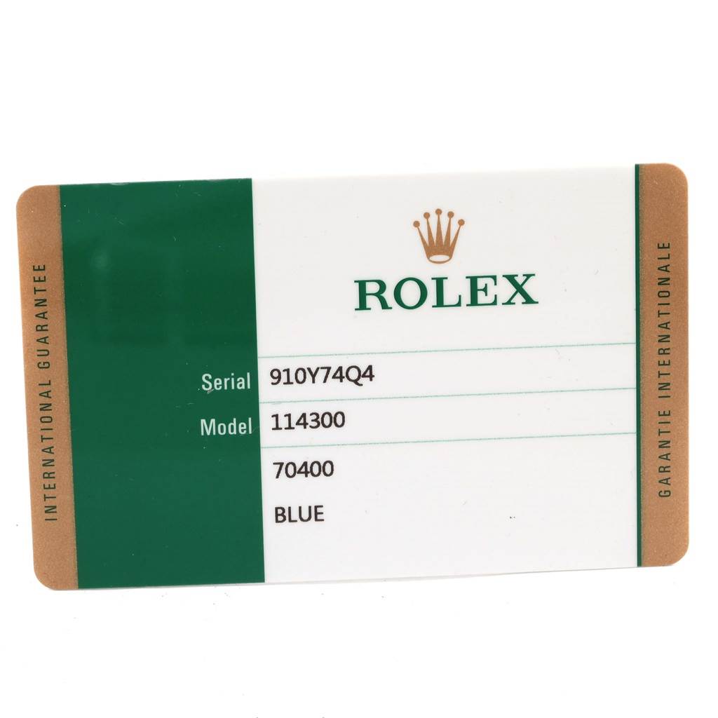 This image shows the International Guarantee card for a Rolex Oyster Perpetual 114300 Men's Stainless Steel Blue Dial 114300 Men's Stainless Steel Blue Dial, model 114300.