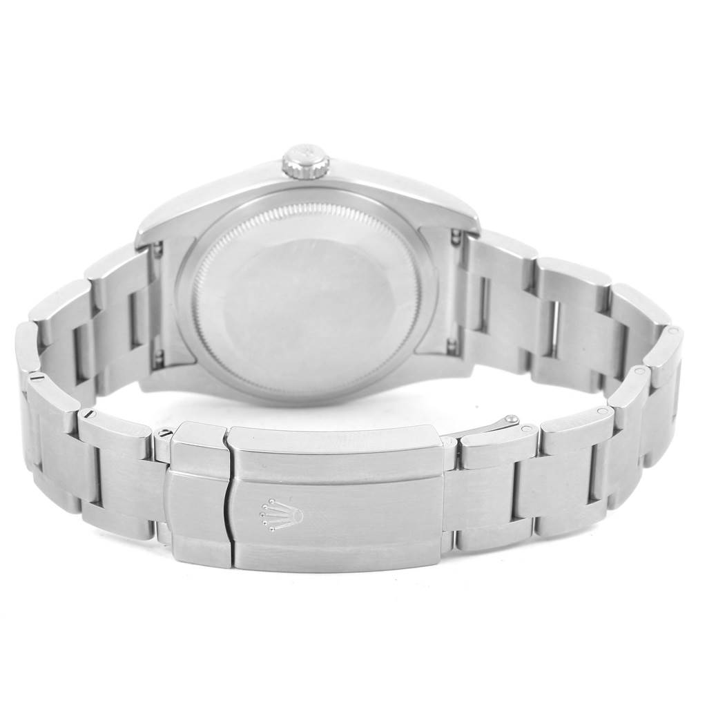 The image shows the back view of a Rolex Oyster Perpetual 116000 Men's Stainless Steel Champagne Dial 116000 Men's Stainless Steel Champagne Dial watch, highlighting its stainless steel case and bracelet.