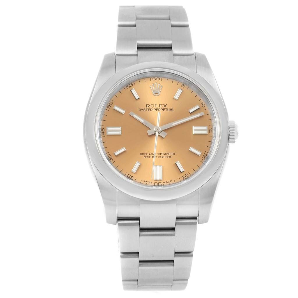The image shows a front view of a Rolex Oyster Perpetual 116000 Men's Stainless Steel Champagne Dial 116000 Men's Stainless Steel Champagne Dial watch with a silver strap and a gold dial.