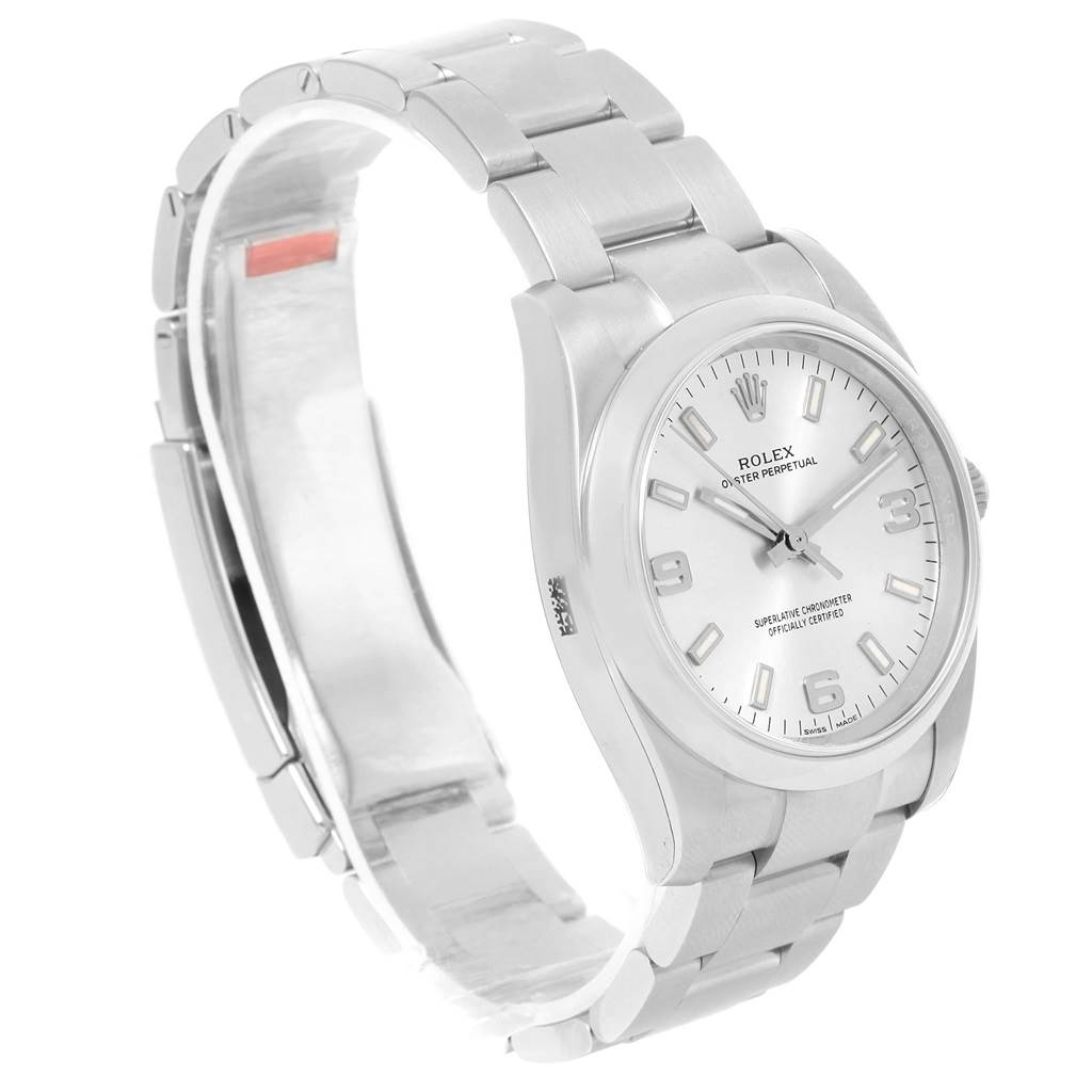 The Rolex Oyster Perpetual 114200 Men's Stainless Steel Silver Dial 114200 Men's Stainless Steel Silver Dial watch is shown at a slight angle, highlighting the face, bracelet, and clasp.