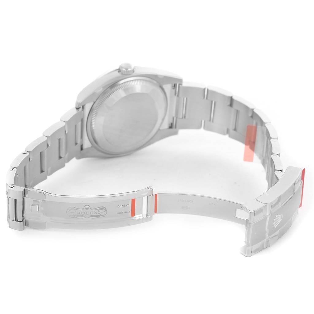 The image shows the back and partially open bracelet clasp of a Rolex Oyster Perpetual 114200 Men's Stainless Steel Silver Dial 114200 Men's Stainless Steel Silver Dial watch, highlighting the open deployant clasp.