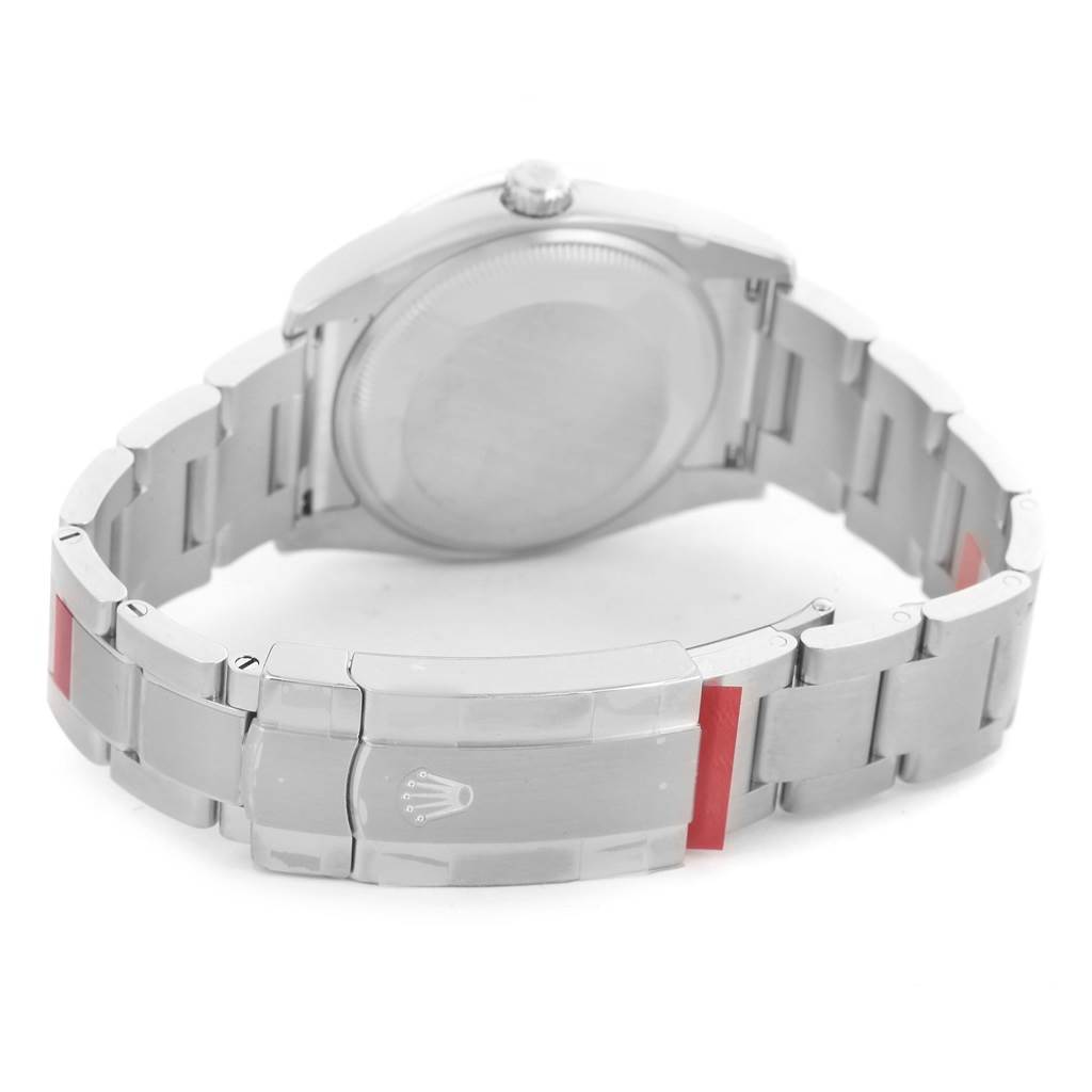 This is a rear view of the Rolex Oyster Perpetual 114200 Stainless Steel Silver Dial 114200 Stainless Steel Silver Dial watch showing the case back and bracelet with clasp.