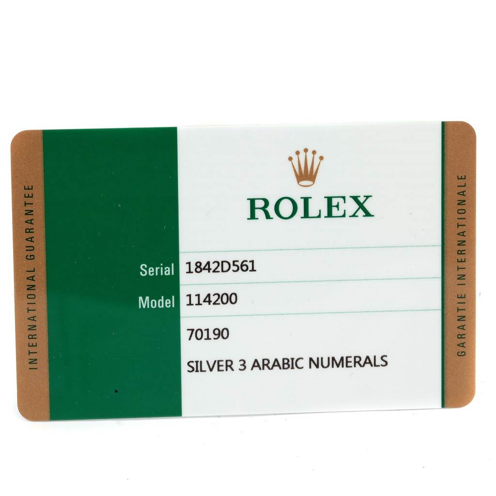 This image shows an international guarantee card for a Rolex Oyster Perpetual 114200 Stainless Steel Silver Dial 114200 Stainless Steel Silver Dial model 114200 watch.