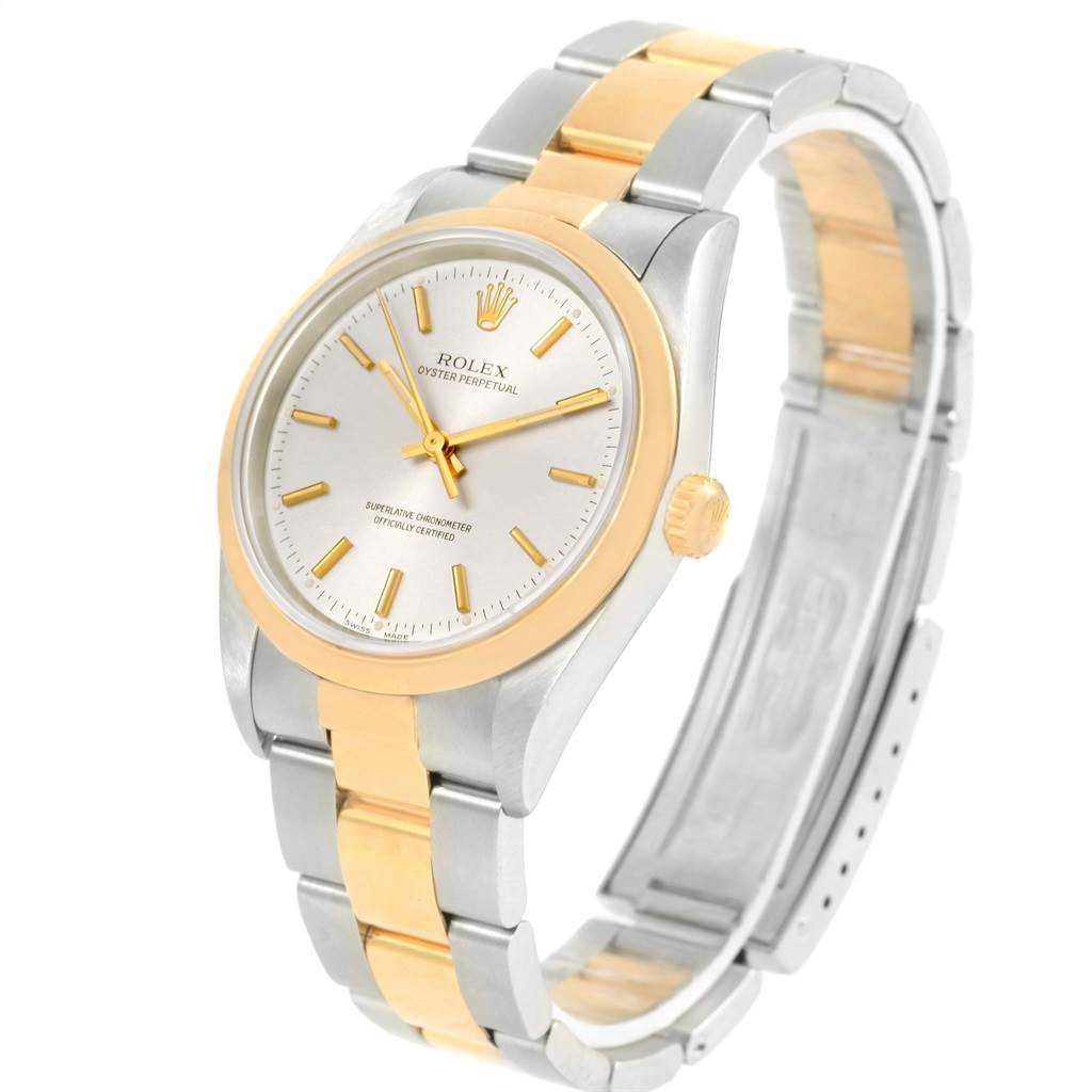 The image shows a Rolex Oyster Perpetual 14203 Men
s Steel and Gold (two tone) Silver Dial 14203 Men
s Steel and Gold (two tone) Silver Dial watch angled to display the face, crown, and two-tone bracelet.
