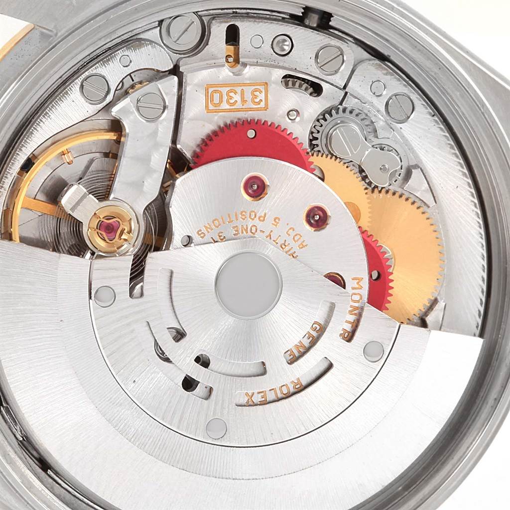 This image shows a close-up view of the movement mechanism inside a Rolex Oyster Perpetual 14203 Men
s Steel and Gold (two tone) Silver Dial 14203 Men
s Steel and Gold (two tone) Silver Dial watch.