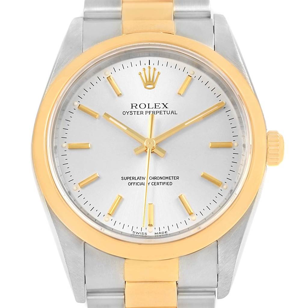 The image shows a front view of the Rolex Oyster Perpetual 14203 Men
s Steel and Gold (two tone) Silver Dial 14203 Men
s Steel and Gold (two tone) Silver Dial watch, highlighting its dial, bezel, and bracelet.