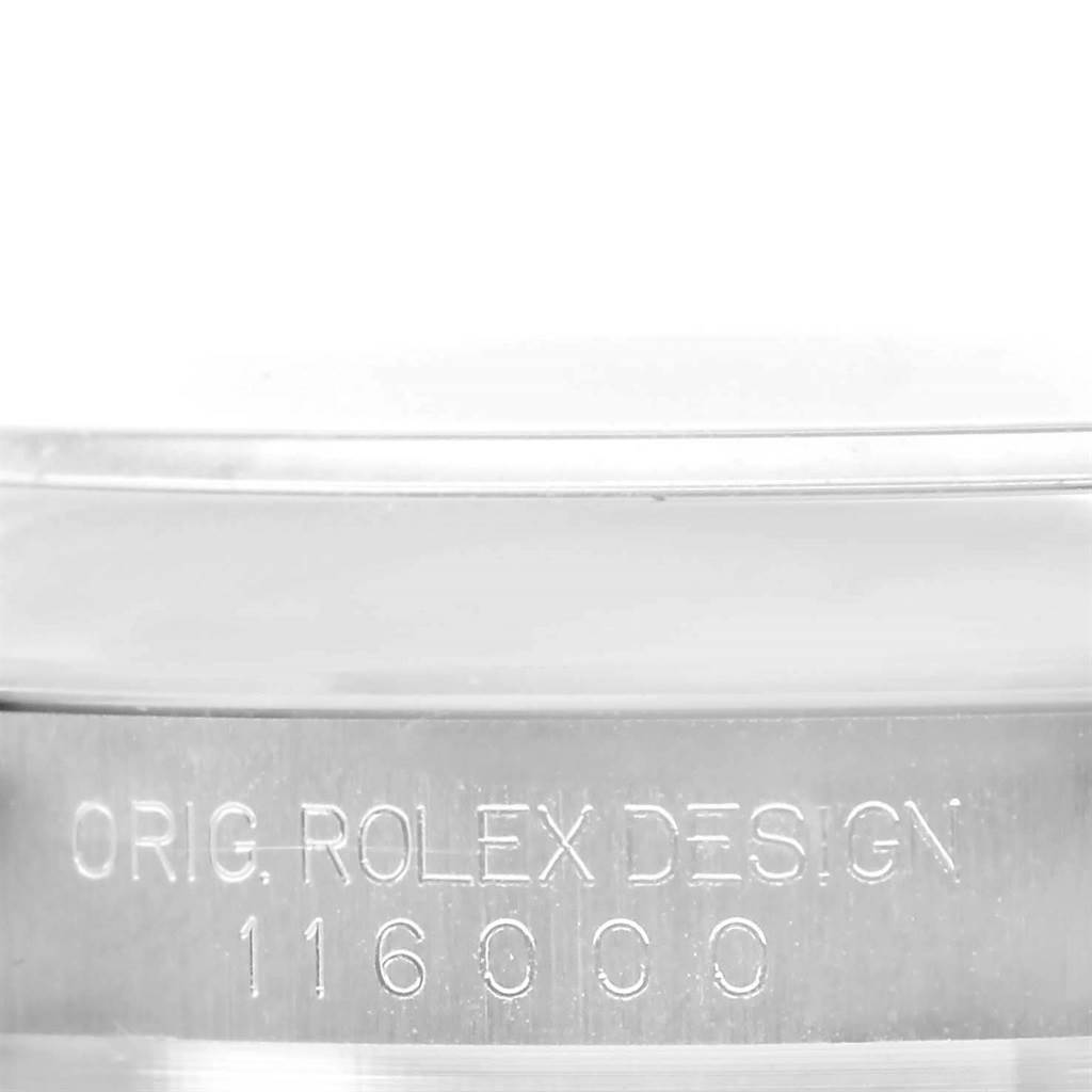 This image shows a close-up of the side casing of a Rolex Oyster Perpetual 116000 Men's Stainless Steel Blue Dial 116000 Men's Stainless Steel Blue Dial watch model 116000.