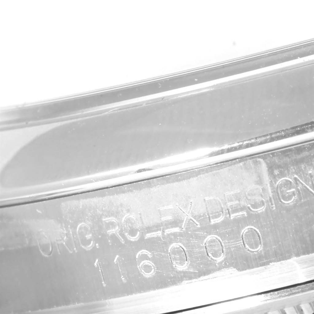 This image shows the engraved side code of a Rolex Oyster Perpetual 116000 Men's Stainless Steel Black Dial 116000 Men's Stainless Steel Black Dial watch, specifically the model number 116000.